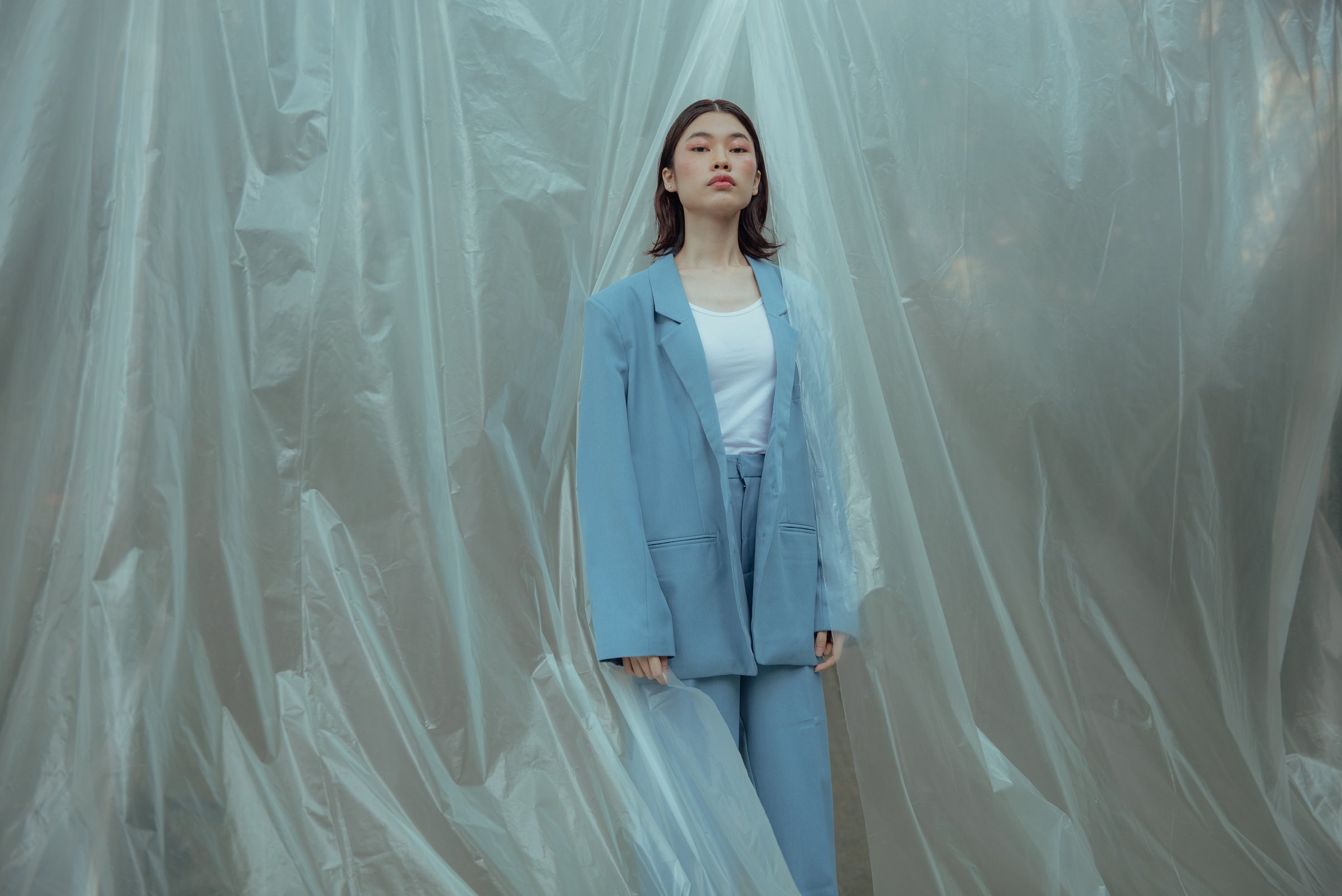 Woman in Suit with Plastic Wrap Background